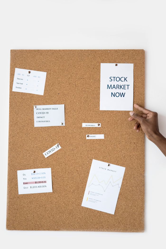 Mastering the First Impression: Your intriguing post title goes here Stock market concepts pinned on a cork board for visual reference.